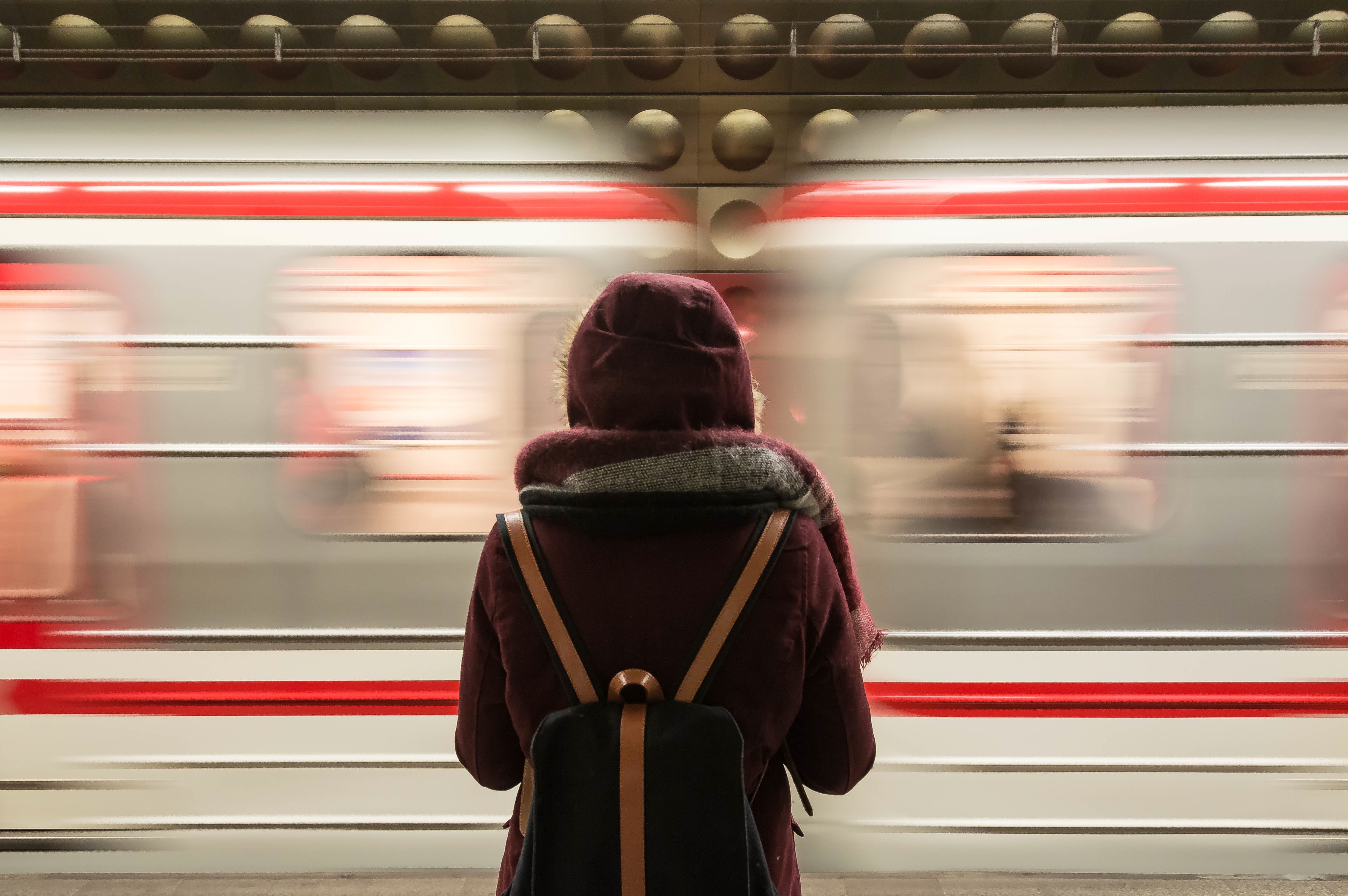 person watching a subway train