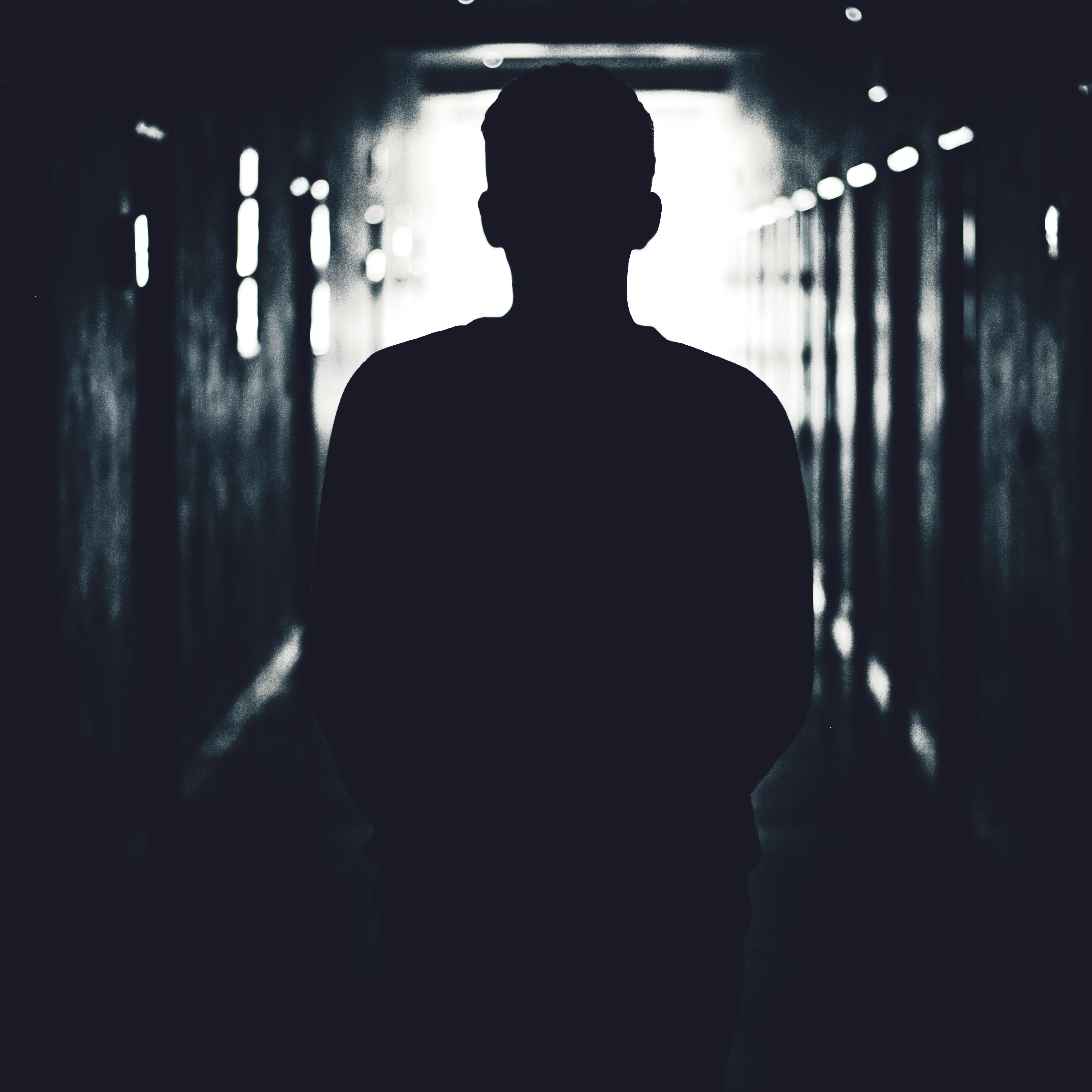 Silhouette of a person in a hallway